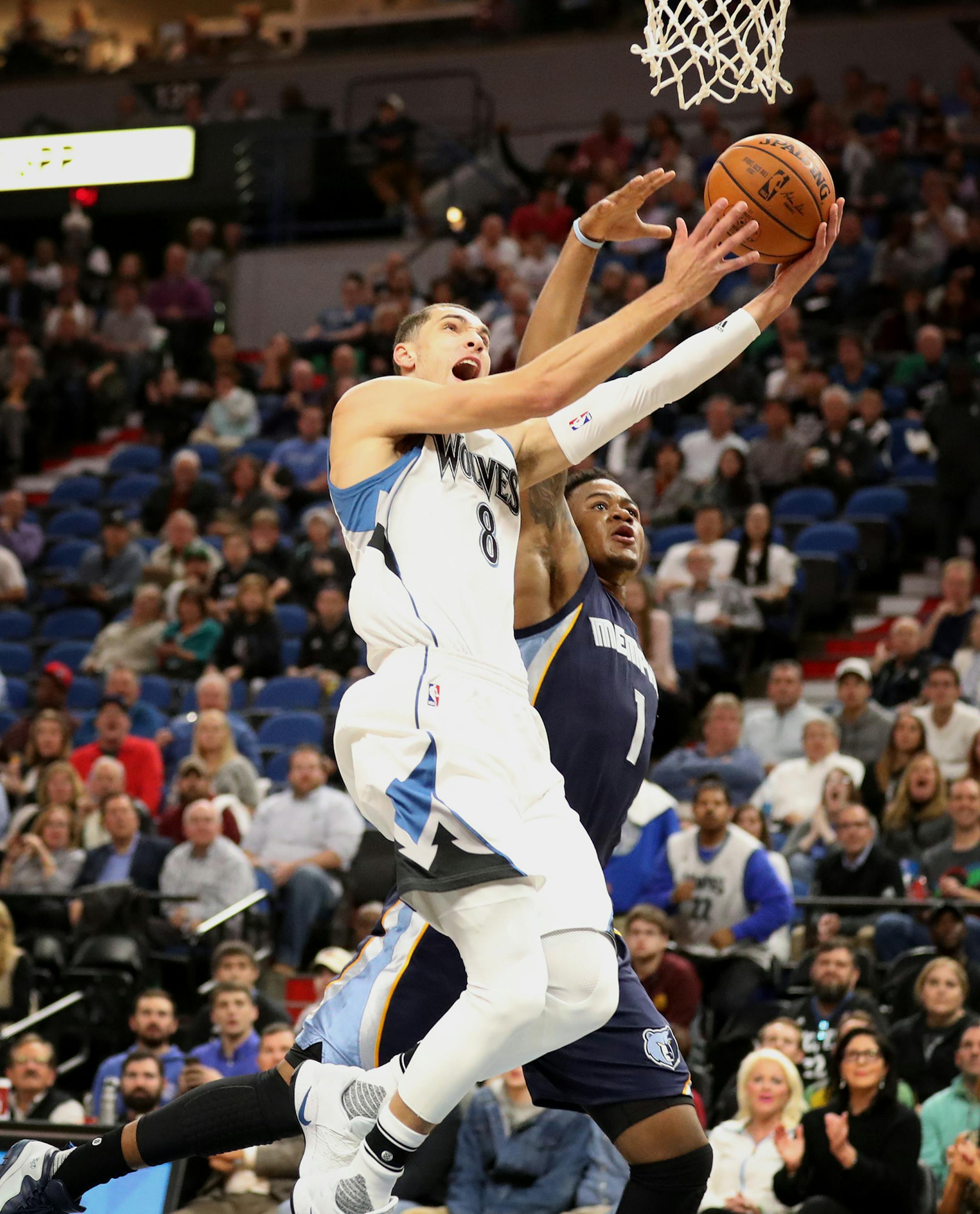 Minnesota Timberwolves guard Zach LaVine (8) shoots as Memphis Grizzlies forward Jarell Martin (1) defends during the first half. ] (Leila Navidi/Star Tribune) leila.navidi@startribune.com BACKGROUND INFORMATION: The Minnesota Timberwolves play the Memphis Grizzlies at Target Center in Minneapolis on Tuesday, November 1, 2016.