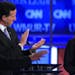 Ex-Pennsylvania Sen. Rick Santorum applauded Rep. Michele Bachmann, R-Minn., on Monday. At far left, CNN's John King.