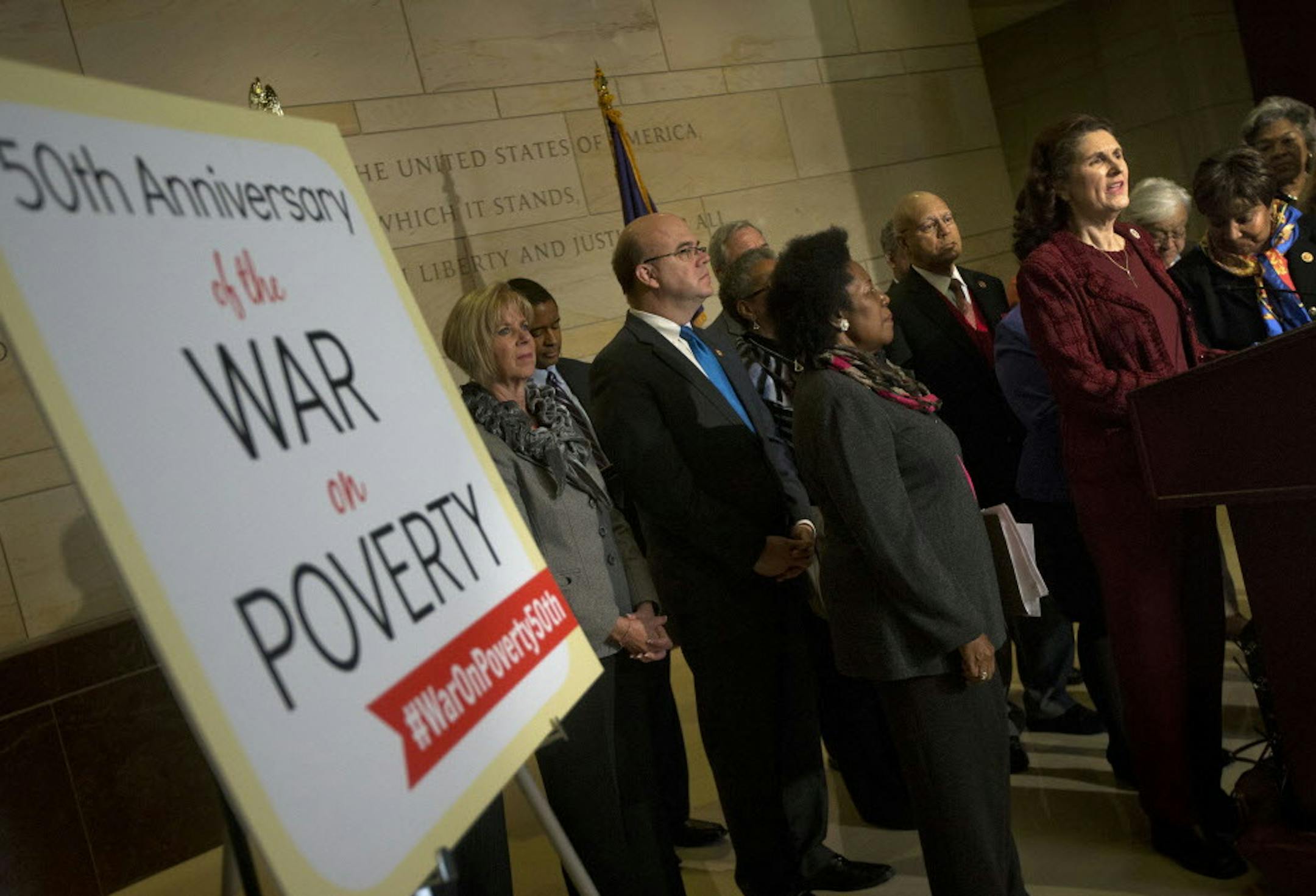 Lynda Johnson Robb, President Lyndon B. Johnson's daughter, right, joined by members of the Congressional Black Caucus and others, speaks during an event on Capitol Hill in Washington, Wednesday, Jan. 8, 2014, marking the 50th anniversary of President Johnson's declaration of the War on Poverty. (AP Photo/Pablo Martinez Monsivais)