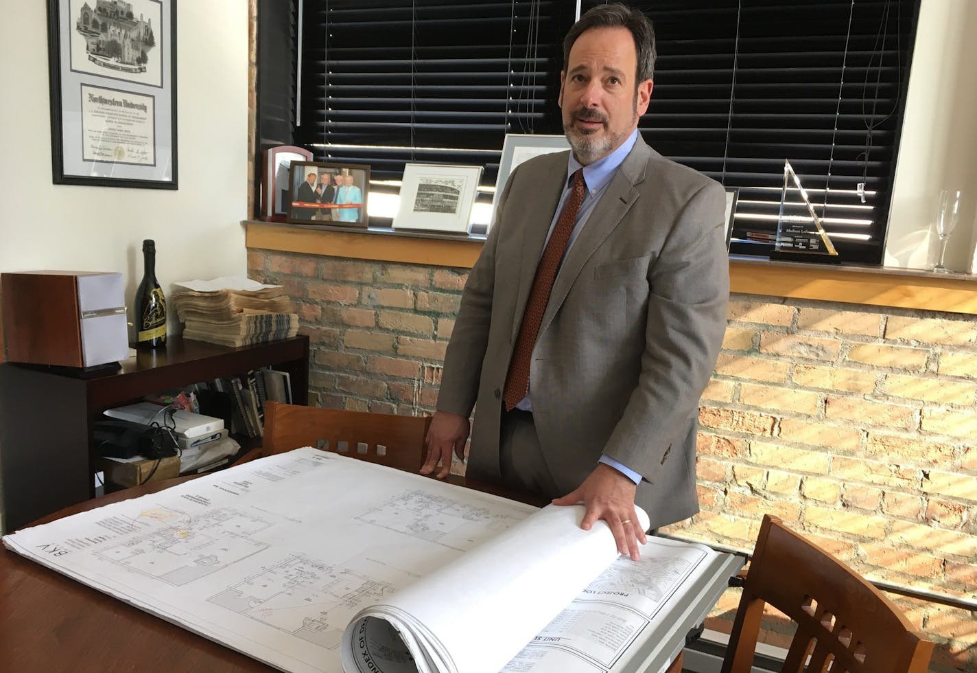 Steve Minn in his office at Madison Lofts, a residential conversion project his company did in Northeast Minneapolis. (Staff photo by Jim Buchta)