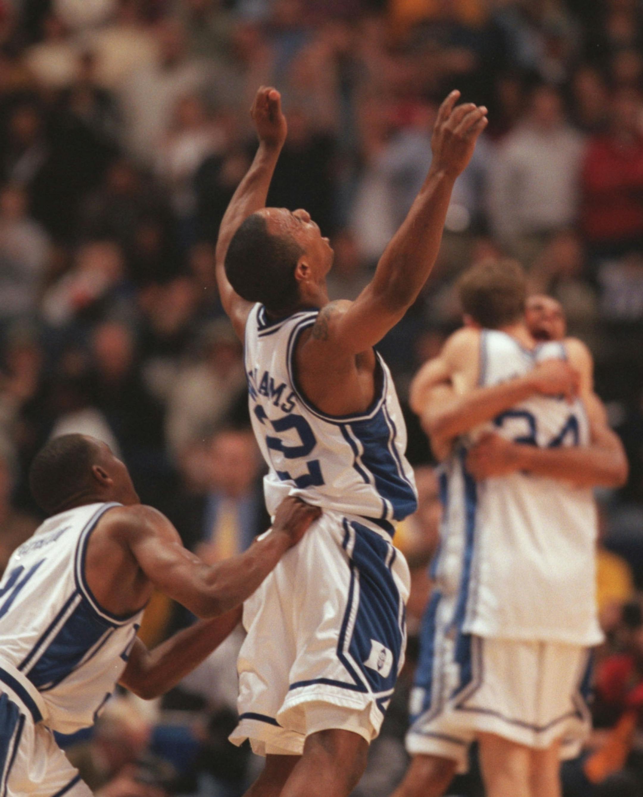 Duke players Chris Duhon and Jason Williams react to their win at the end of the championship game during the 2001 Final Four. (Jeff Wheeler/Star Tribune)