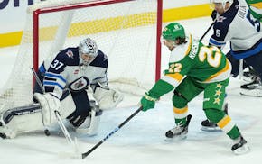 Wild center Marat Khusnutdinov takes a close-range shot on Jets goalie Connor Hellebuyck on Saturday at Xcel Energy Center.