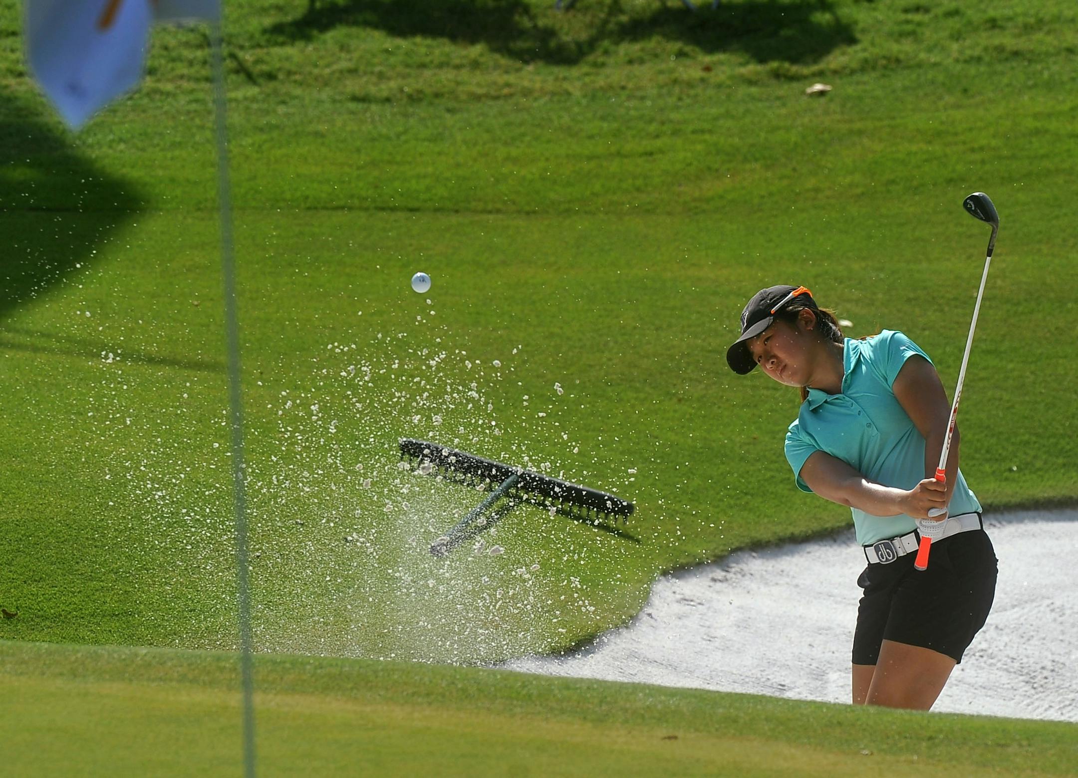 Jing Yan, of China, chips out of the sand on the 11th hole during the LPGA Wal-Mart NW Arkansas Championship golf tournament at Pinnacle Country Club in Rogers, Ark., Saturday, June 25, 2016. (Michael Woods/The Arkansas Democrat-Gazette via AP) MANDATORY CREDIT
