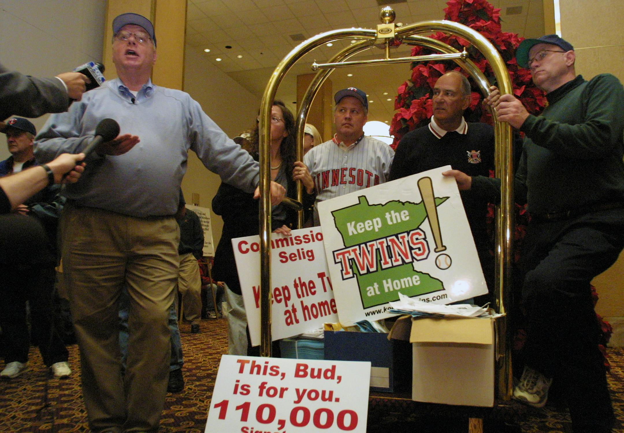 In 2001, Paul Ridgeway, left, delivered petitions to support keeping the Minnesota Twins from being dissolved or moved, just one of the many high-profile enterprises in Minnesota with which he has been involved. Now, the entrepreneur is struggling to pay bills.