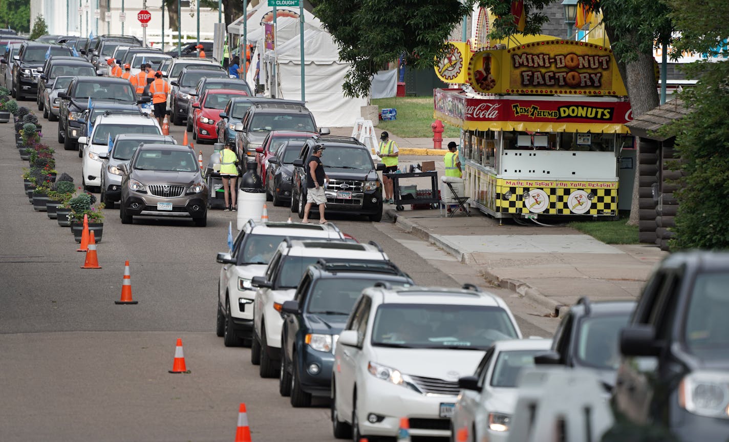 It was more of a traffic jam than a people jam as the Minnesota State Fair Food Parade got underway Thursday morning. The three weekend event served up favorite fair food to drive up cars at various vendors. brian.peterson@startribune.com St. Paul, MN Thursday, August 20, 2020