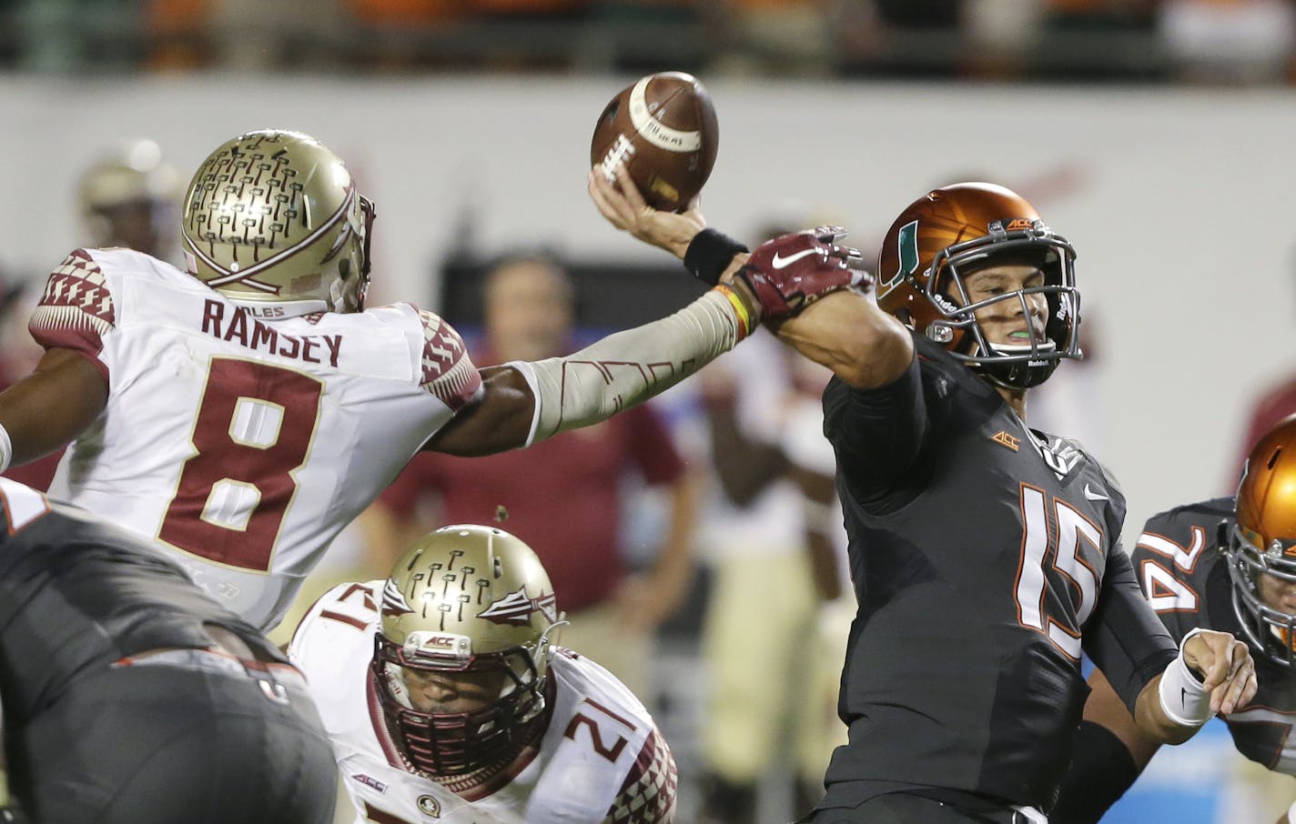 Florida State defensive back Jalen Ramsey (8) blocks a pass by Miami quarterback Brad Kaaya (15) during the second half of an NCAA College football game, Saturday, Nov. 15, 2014 in Miami Gardens, Fla. Florida State defeated Miami 30-26. (AP Photo/Wilfredo Lee)