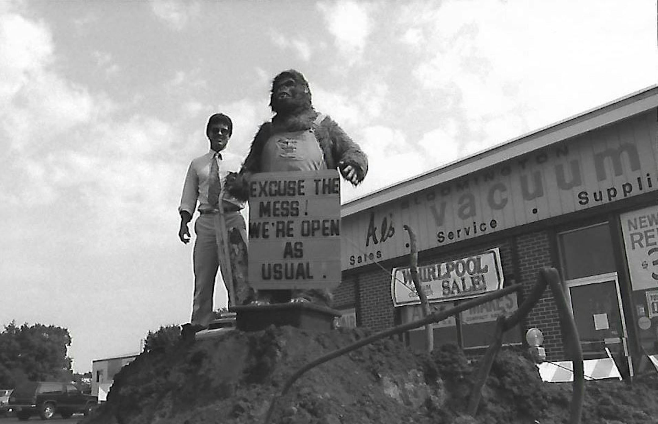 Al Allstadt poses with Al's Vacuum's large mechanical gorilla during construction outside the shop's old location in Bloomington in around 1987.