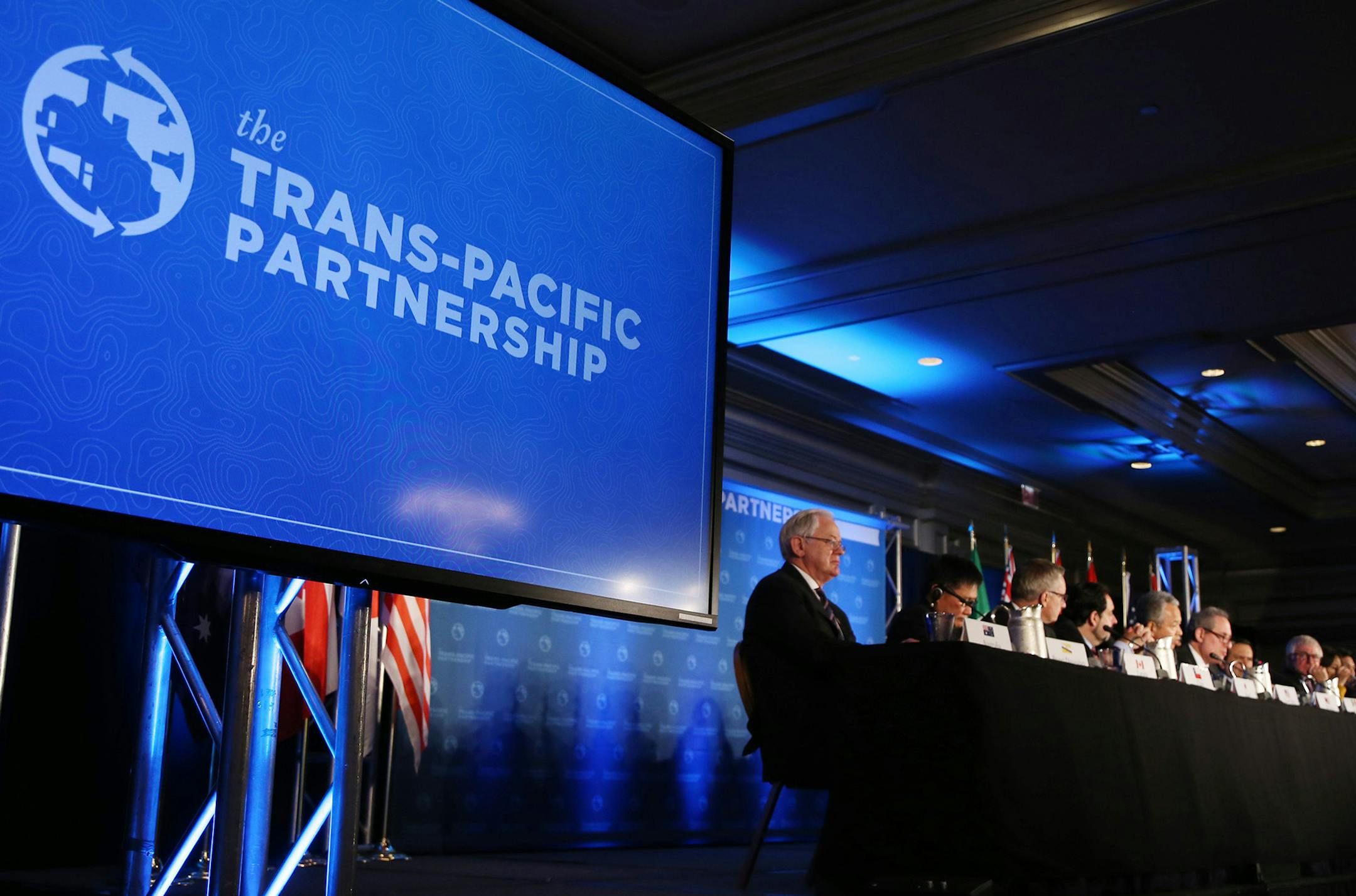 Akira Amari (5th from L), Japanese state minister in charge of TPP negotiations, U.S. Trade Representative Michael Froman (6th from L) and delegates from 10 countries attend a joint press conference at a hotel in Atlanta, U.S.A. on Oct. 5, 2015, after reaching an agreement on the Trans-Pacific Partnership free trade pact (TPP). The deal will create a huge economic zone that will account for 40 percent of the global economy in terms of gross domestic product. ( The Yomiuri Shimbun via AP Images )