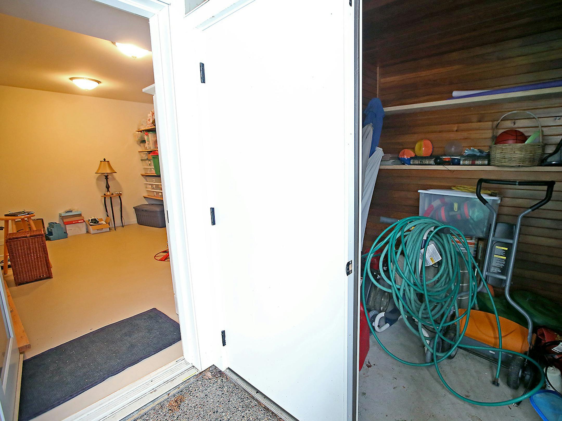 The new storage room, left, and a smaller storage space for lawn and pool equipment, right.