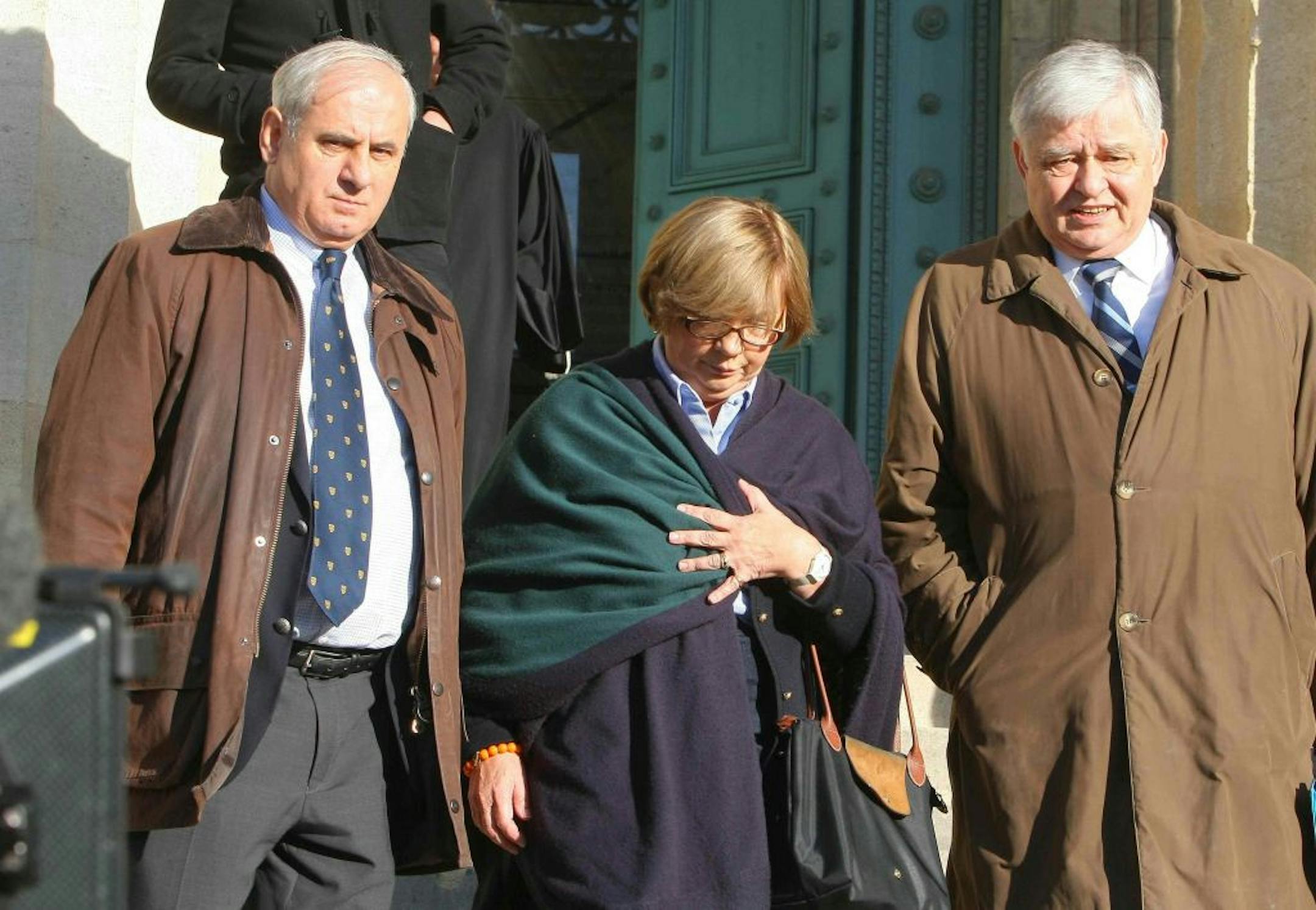 Christine de Vedrines, center, and Philippe de Vedrines, right, left the court in Bordeaux, France, after their "protector" was convicted.