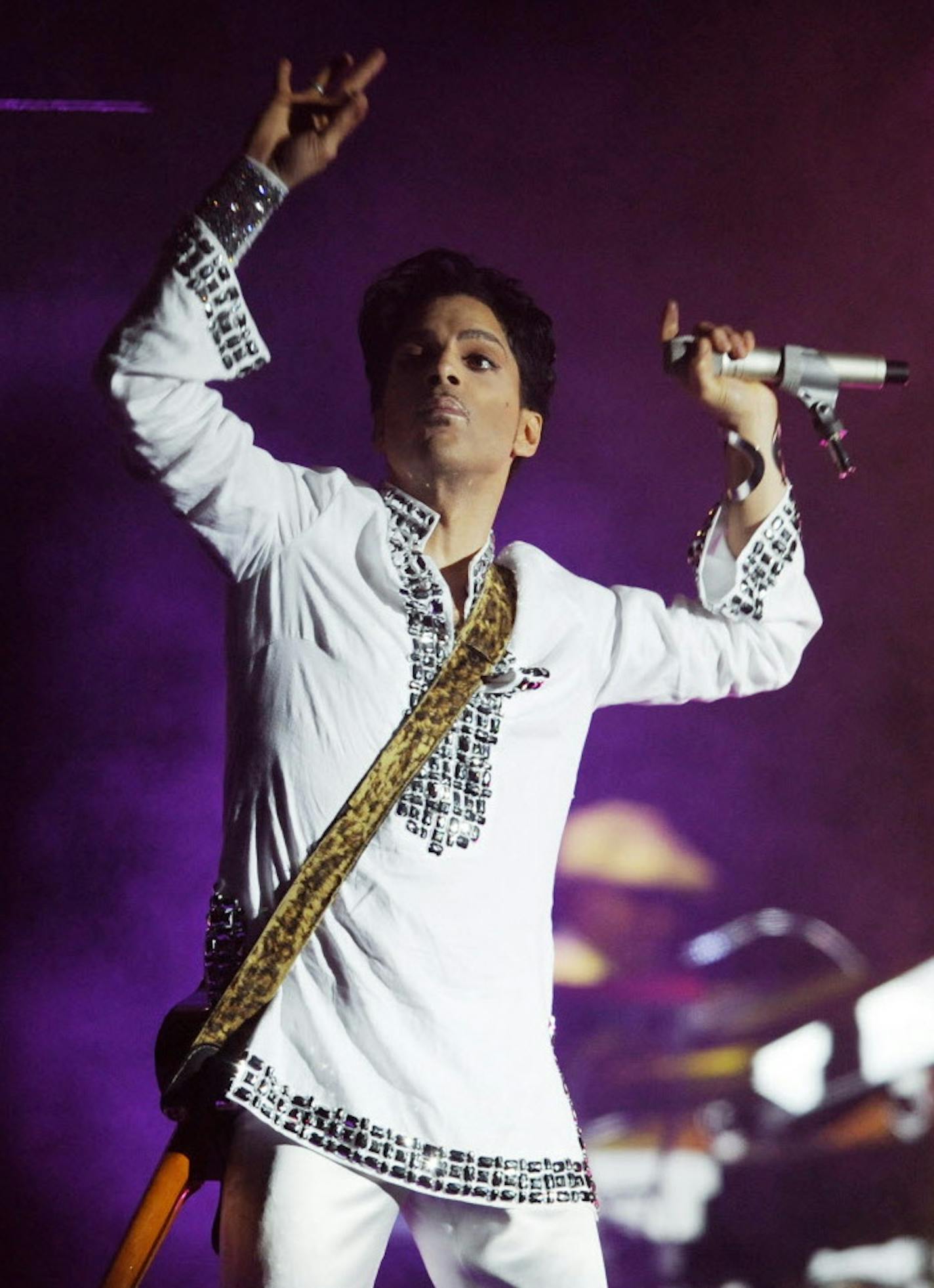 FILE - In this April 26, 2008 file photo, Prince performs during the second day of the Coachella Valley Music and Arts Festival in Indio, Calif. Paisley Park will host a four-day celebration of the "Purple Rain" megastar's life next year. "Celebration 2017" will be held April 20-23 during the anniversary of his death. Prince was found dead at his home on April 21, 2016, in suburban Minneapolis. He was 57. (AP Photo/Chris Pizzello, File)