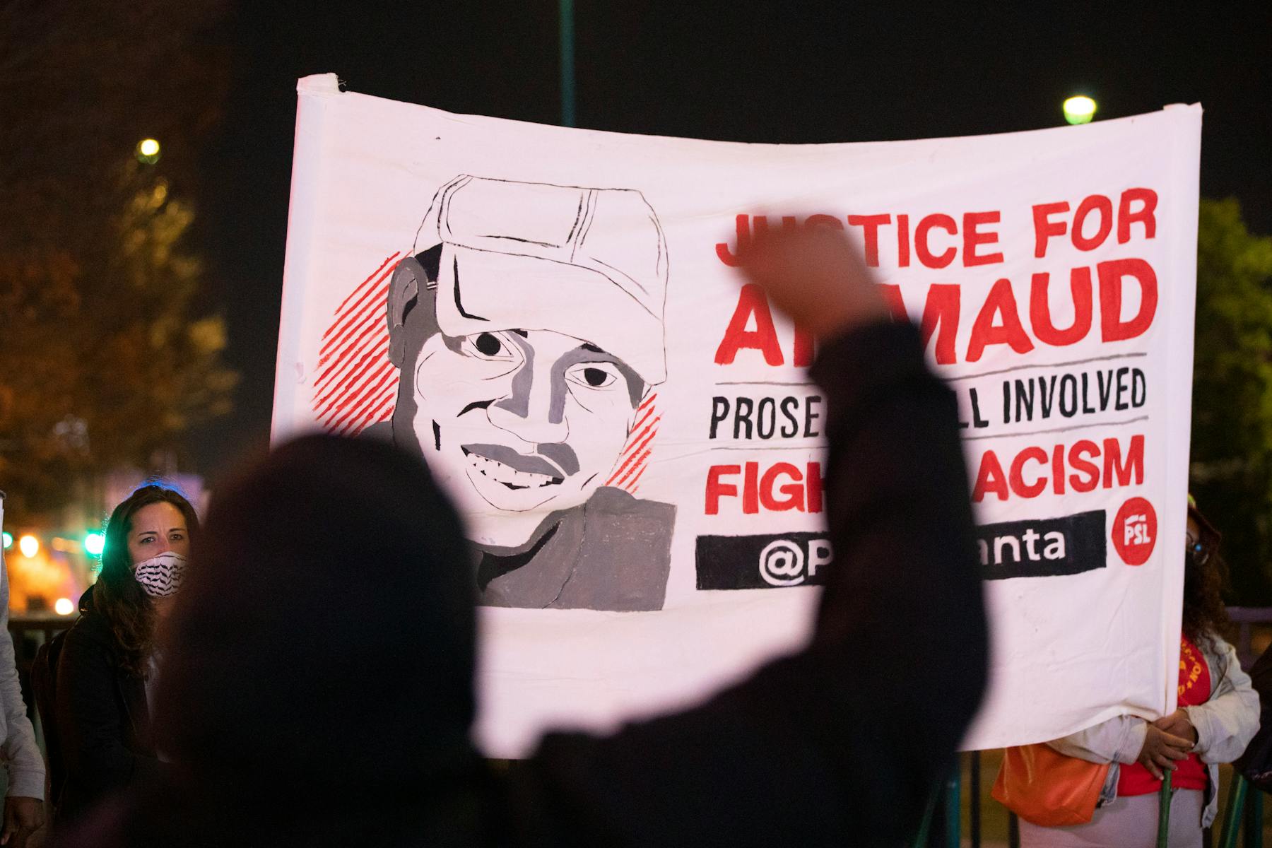 A vigil in Atlanta Centennial Olympic Park hours after three men were convicted of Ahmaud Arbery’s murder in November 2021.