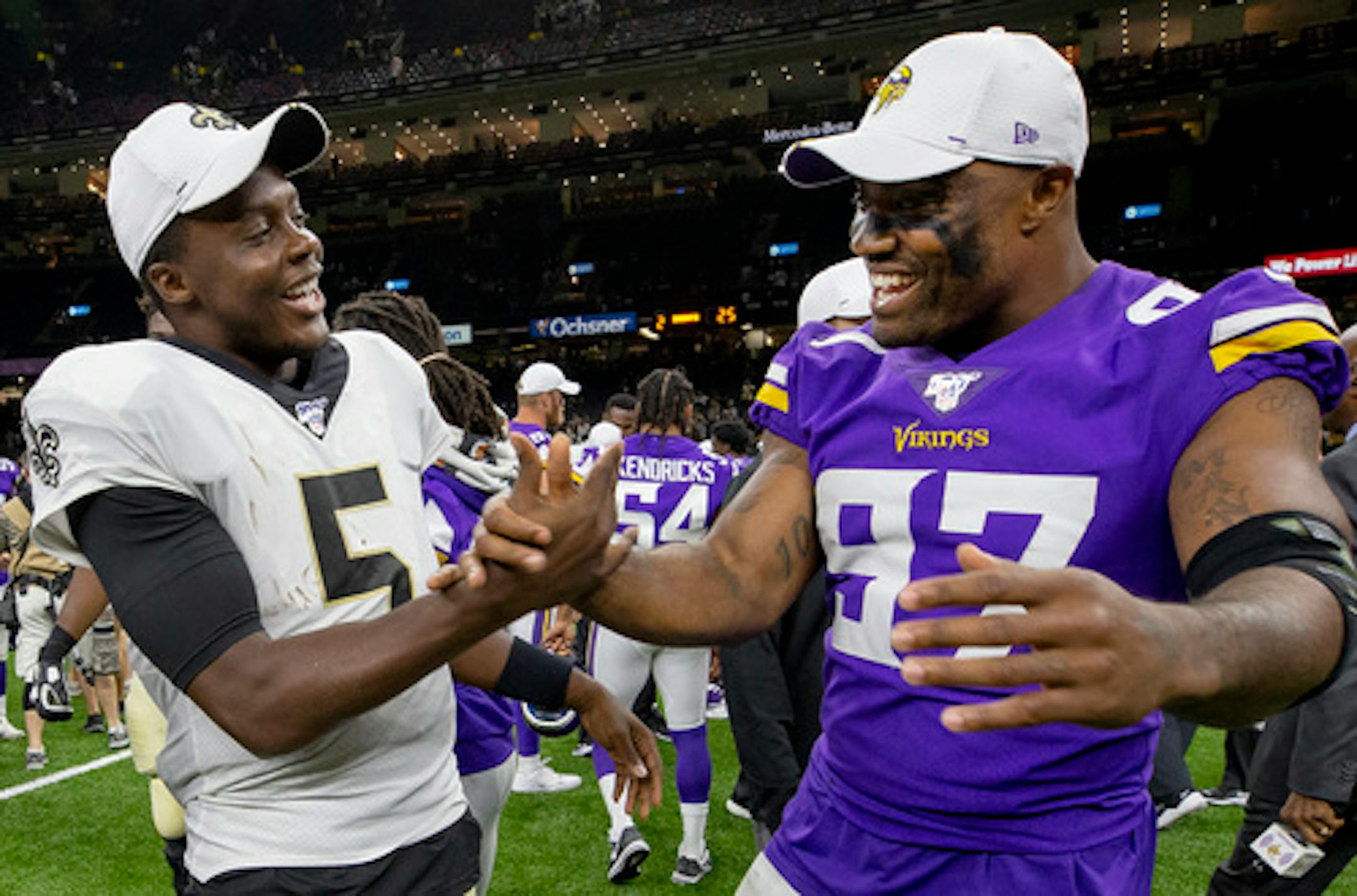 Saints quarterback Teddy Bridgewater and Minnesota Vikings Everson Griffen greeted each other after the game.