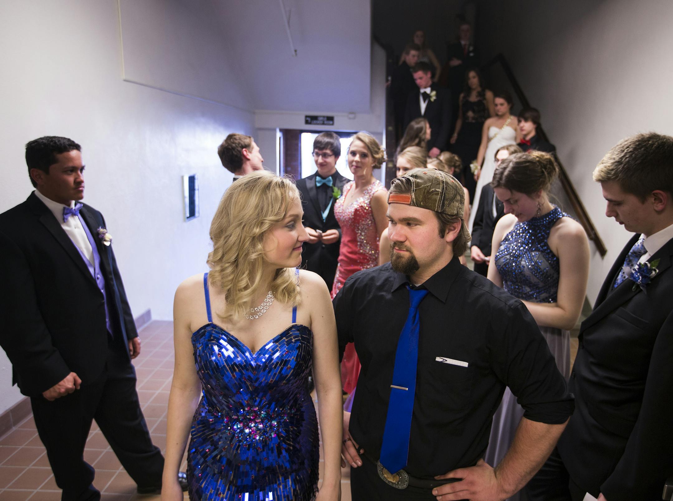 Seniors Allie Hill and her prom date Austin Verbonich line up for the grand march before prom. ] (Leila Navidi/Star Tribune) leila.navidi@startribune.com BACKGROUND INFORMATION: Allie Hill, who's dad works at U.S. Steel's Minntac taconite pellet plant, plans to go to Mesabi Range College on scholarships to study conservation or forestry. Austin plans to go into the auto industry, which he sees as more stable than mining. The Eveleth-Gilbert High School prom grand march on Saturday, April 30, 201