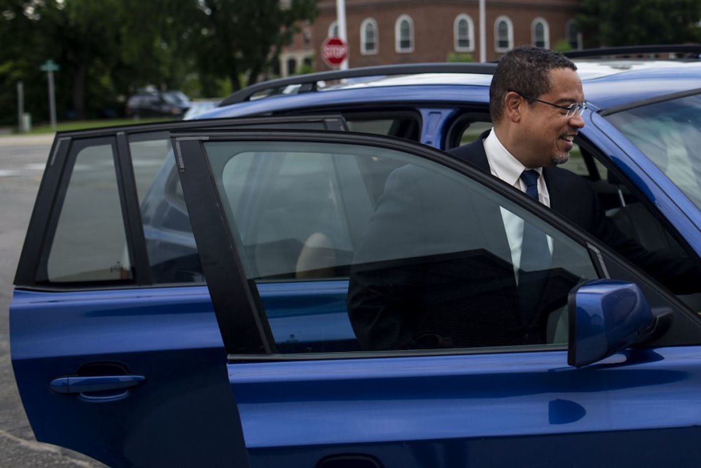 Attorney General Keith Ellison leaves Fergus Falls City Hall after holding a public listening session there.