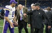 Minnesota Vikings head coach Mike Zimmer celebrated their win with Minnesota Vikings quarterback Kirk Cousins (8) at Ford Field.] Jerry Holt • Jerry