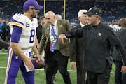 Minnesota Vikings head coach Mike Zimmer celebrated their win with Minnesota Vikings quarterback Kirk Cousins (8) at Ford Field.] Jerry Holt • Jerry