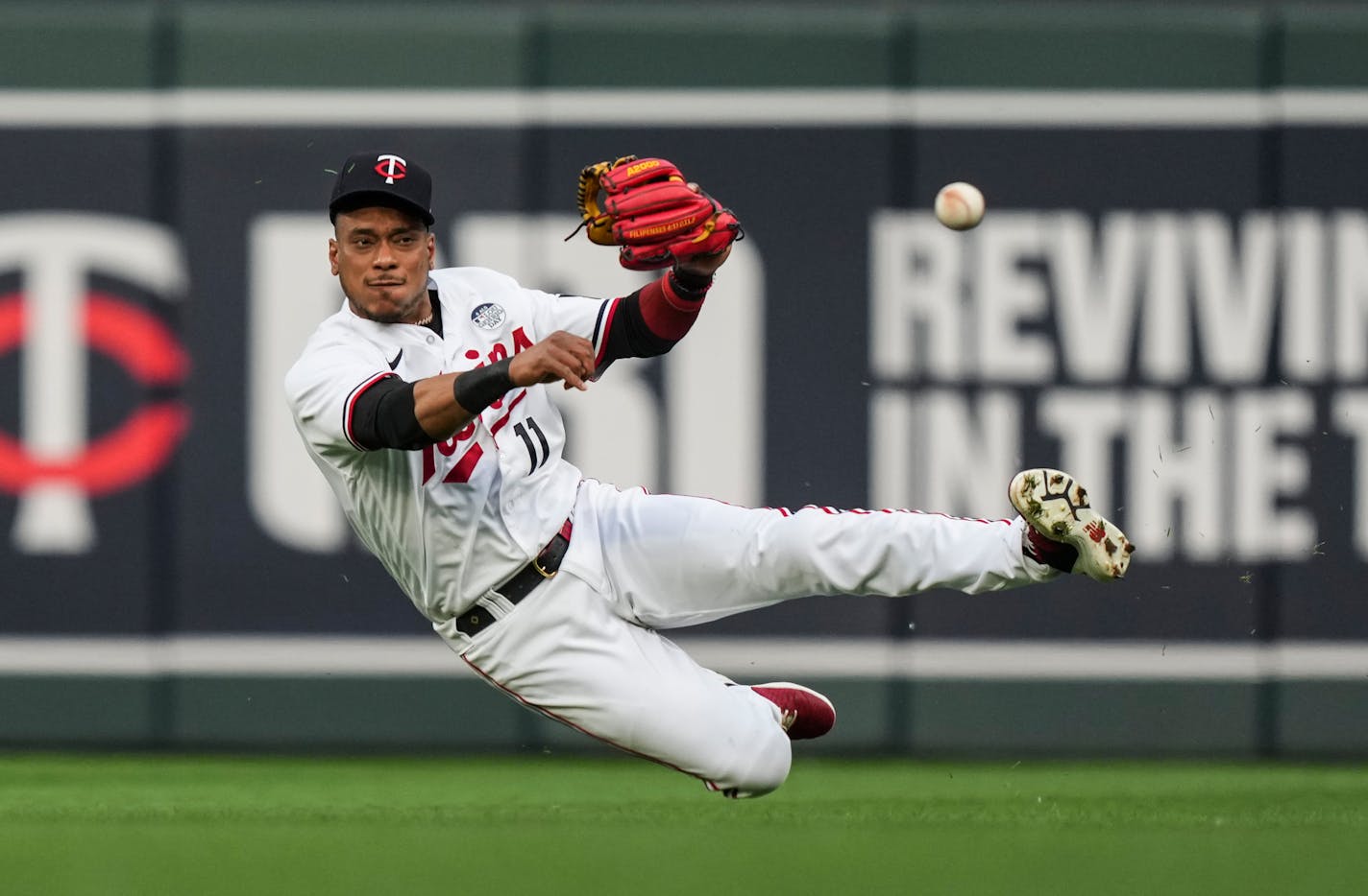 Minnesota Twins second baseman Jorge Polanco (11) misses the catch before grabbing it and throwing it to first to get Cleveland Guardians second baseman Andres Gimenez (0) out at first in the second inning. The Minnesota Twins hosted the Cleveland Guardians at Target Field in Minneapolis on Friday, June 2, 2023. ] RENÉE JONES SCHNEIDER • renee.jones@startribune.com