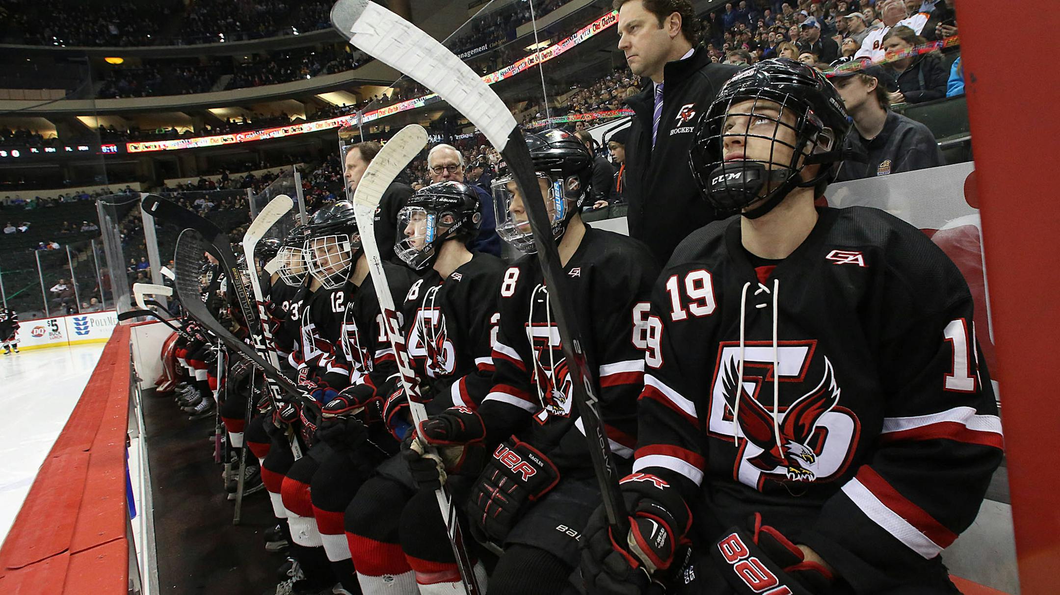 Eden Prairie‚Äôs Michael Parrish (#19) sat on the bench with his teammates moments before the game was to begin.] JIM GEHRZ ‚Ä¢ jgehrz @startribune.com / St. Paul, MN / March 7, 2014 / 6:00 PM BACKGROUND INFORMATION: Lakeville North High School played Eden Prairie in the semifinals of the 2014 State Class 2A Hockey Tournament at the Xcel Energy Center.