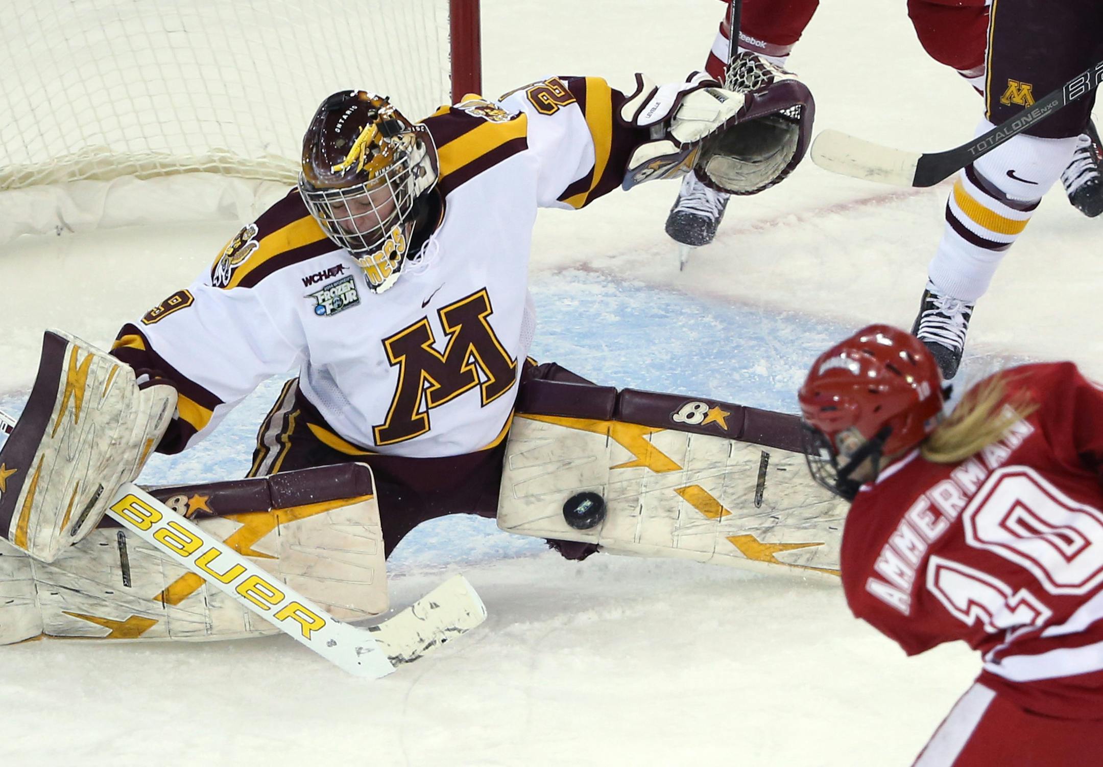 Gopher goalie Amanda Leveille blocked a shot from Wisconsin's Brittany Ammerman during first period of the game Friday, March 21, 2014.