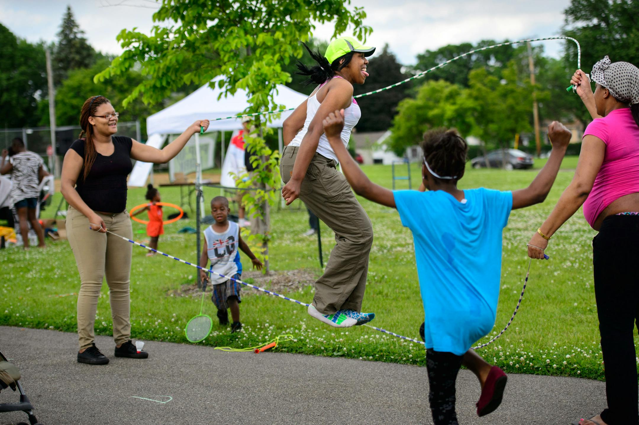Cynequa Hair and Sa'mya Coleman jumped rope at the Pop Up Park in Jordan Park in North Minneapolis. One of the free activities was to string together jump ropes. ] GLEN STUBBE * gstubbe@startribune.com Tuesday June 17, 2014