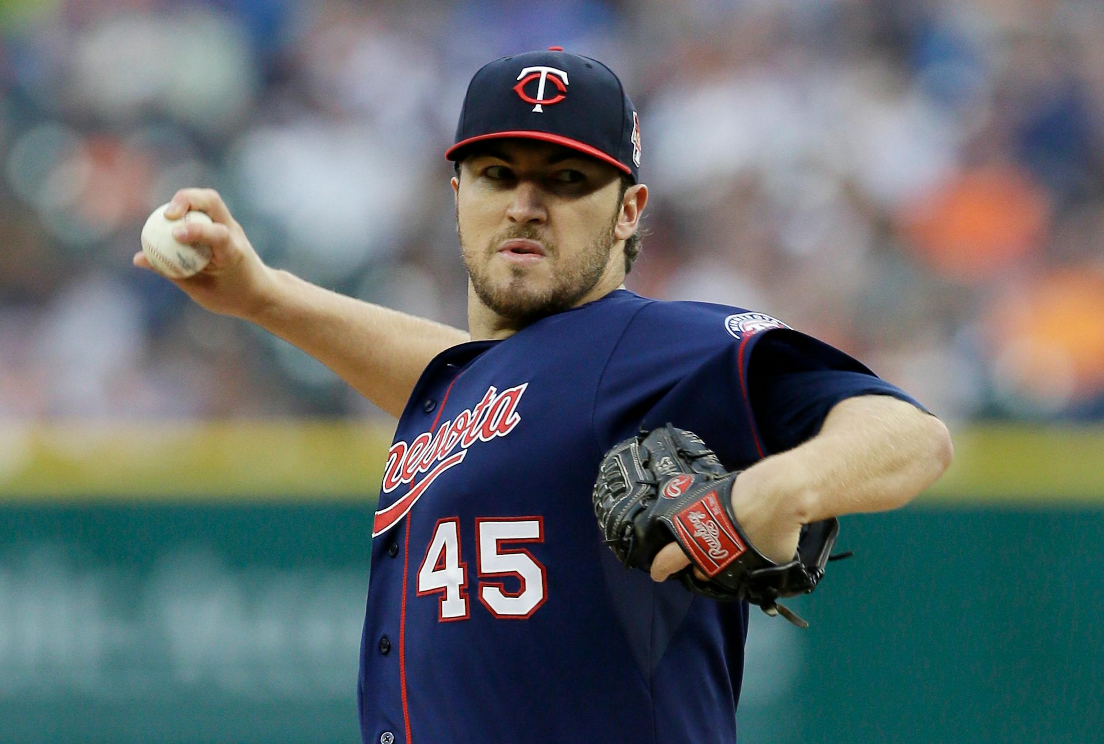 Minnesota Twins starting pitcher Phil Hughes throws during the first inning of a baseball game against the Detroit Tigers in Detroit, Friday, May 9, 2014. (AP Photo/Carlos Osorio)