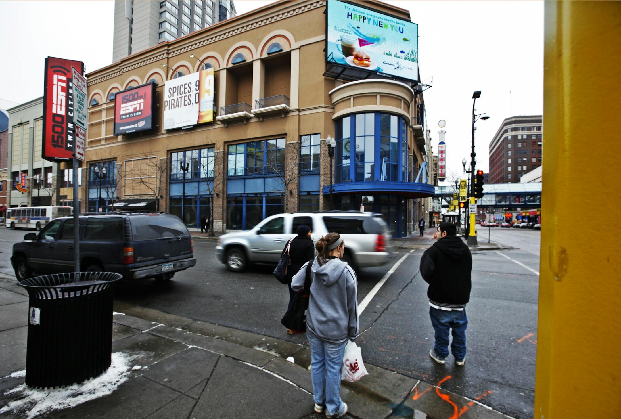 Pedestrians prepare to cross 7th Street, near Hennepin Ave. at Block E, Jan. 25, 2012, in Minneapolis.