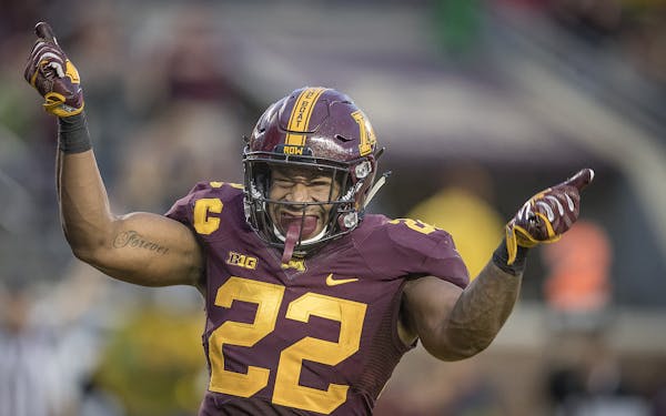 Gophers running back Kobe McCrary celebrated a touchdown during the fourth quarter Saturday against Illinois.