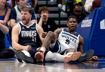 Luka Doncic (77) of the Mavericks reacts after Anthony Edwards of the Timberwolves is called for an offensive foul tonight in Dallas.