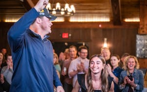 Joe Alt celebrates with girlfriend Emilie Meyer at 7 Vines Vineyard and Winery in Dellwood after being picked fifth overall by the Los Angeles Charger