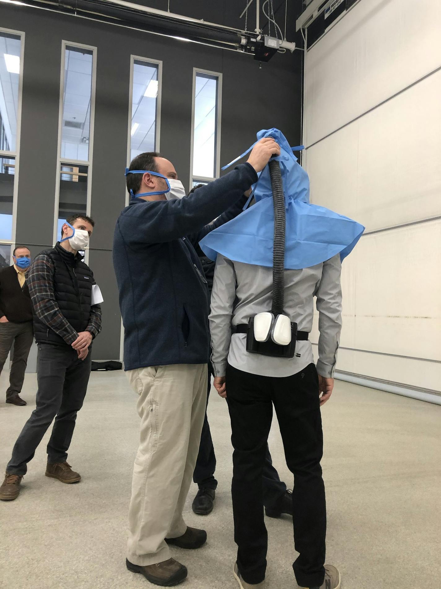 A powered air purifying respirator (PAPR) is tested at Cirrus Aircraft in Duluth. The airplane manufacturer is producing hundreds of parts for the in-demand protective gear.