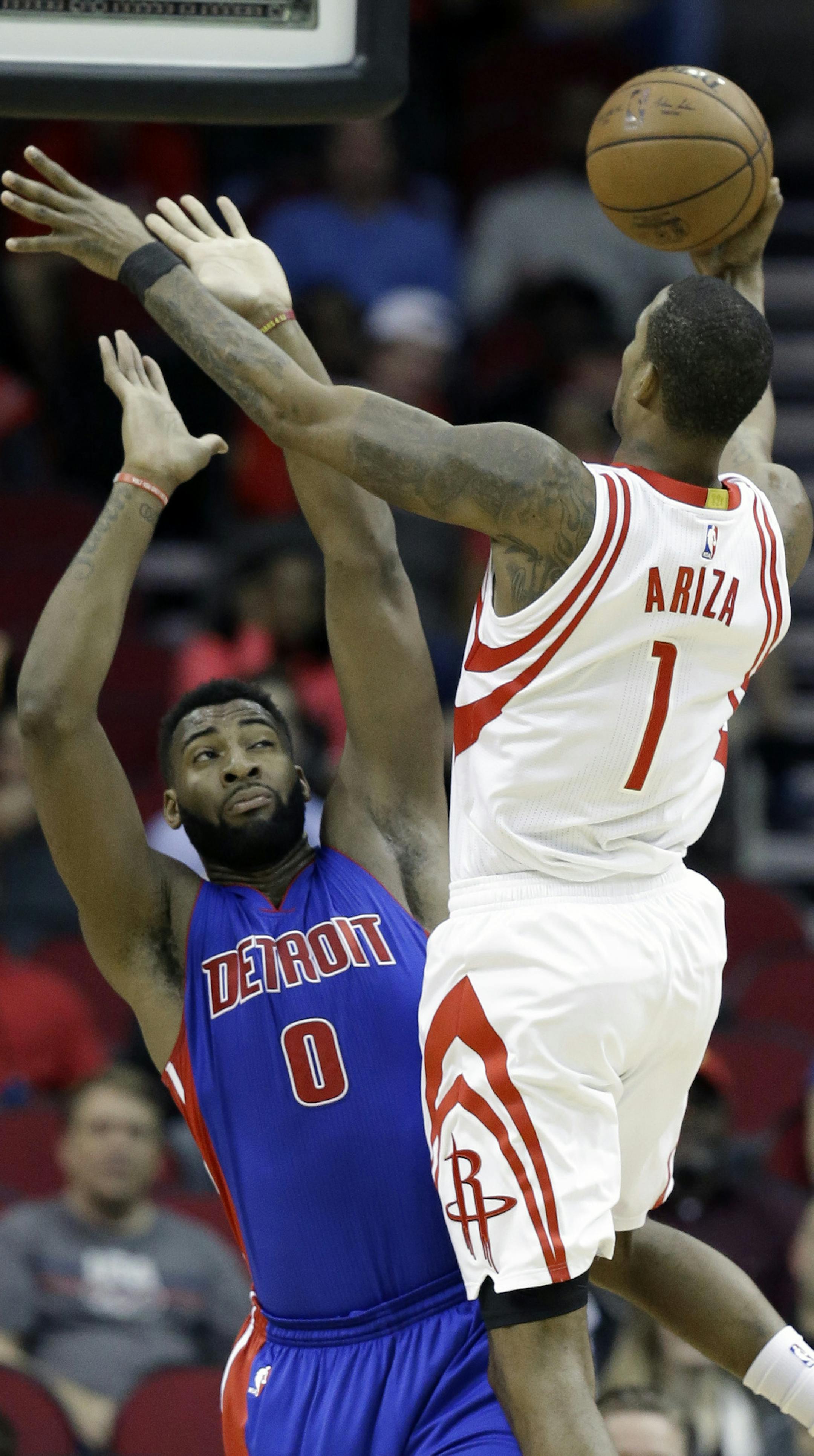 Houston Rockets' Trevor Ariza (1) shoots over Detroit Pistons' Andre Drummond (0) in the first half of an NBA basketball game, Wednesday, Jan. 20, 2016, in Houston. (AP Photo/Pat Sullivan)