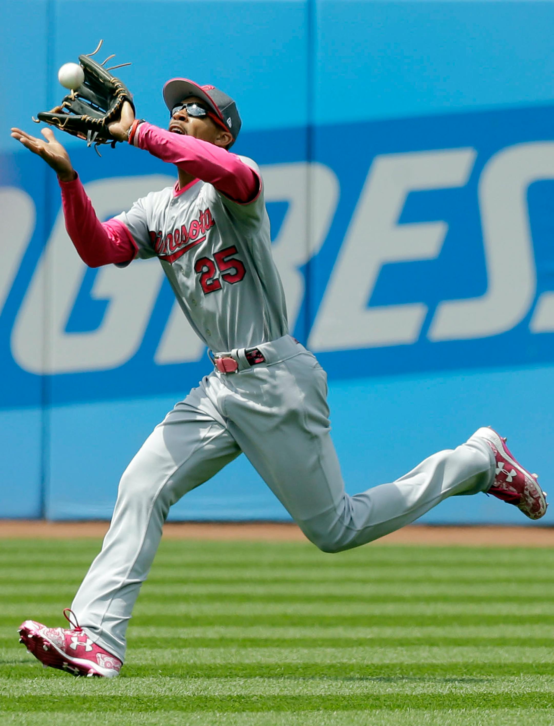 Minnesota Twins' Byron Buxton catches a ball hit by Cleveland Indians' Michael Brantley in the third inning of a baseball game, Sunday, May 14, 2017, in Cleveland. Brantley was out on the play.