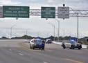Police vehicles block the entrance to the Pensacola Air Base, Friday, Dec. 6, 2019 in Pensacola, Fla. The US Navy is confirming that a shooter is dead