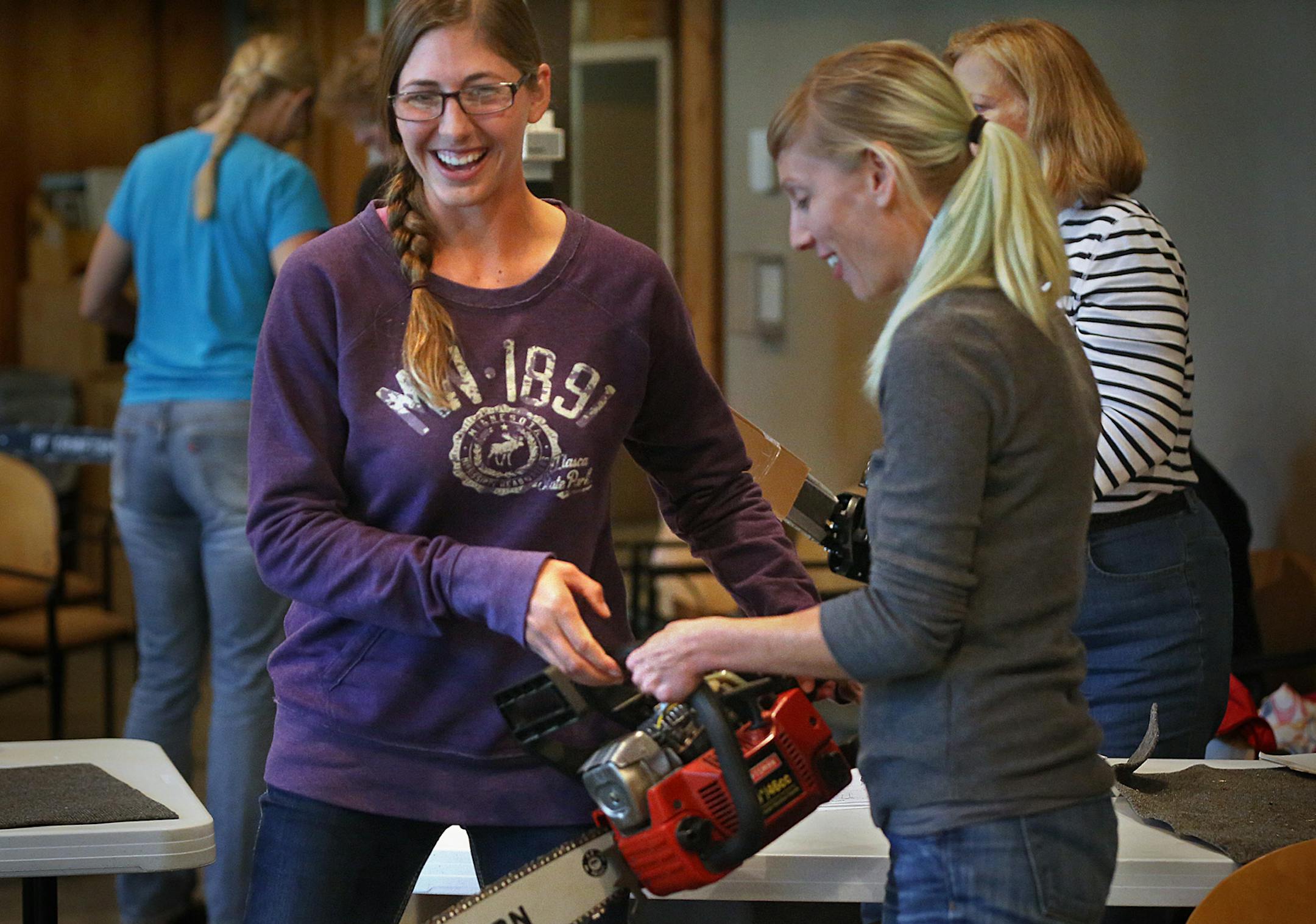 Emily Mumford (left), and Jeffifer Gehlhar, both from St. Paul, practiced the proper handling of a chainsaw during a female-only chainsaw class in Bloomington. ] JIM GEHRZ &#x201a;&#xc4;&#xa2; jgehrz@startribune.com / Bloomington, MN / Sept. 20, 2014 / 12:00 PM / BACKGROUND INFORMATION: Invasive buckthorn plant has become more than a nuisance to Twin Cities residents, who are unable to control its rapid growth. Suburbs are spending considerable time and money to eradicate the problem, which some