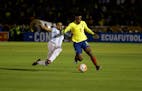 Ecuador's Romario Ibarra, right, fights for the ball against Argentina's Gabriel Mercado during their 2018 World Cup qualifying soccer match at the At
