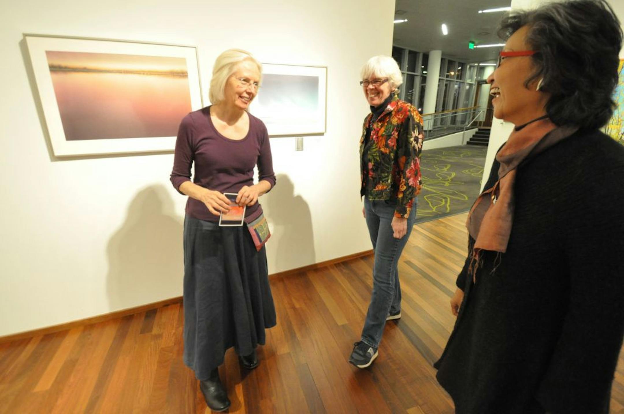Photo by Liz RolfsmeierArtists Nanci Yermakoff, Mary Lingen, Joonja Lee Mornes chatted at the opening reception for their �Color, Motion, Landscape� exhibit, currently on display at the Burnsville Performing Arts Center.