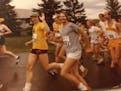 Doug Smith, left, during Grandma's Marathon in 1980. He ran his best marathon there in 3:31.