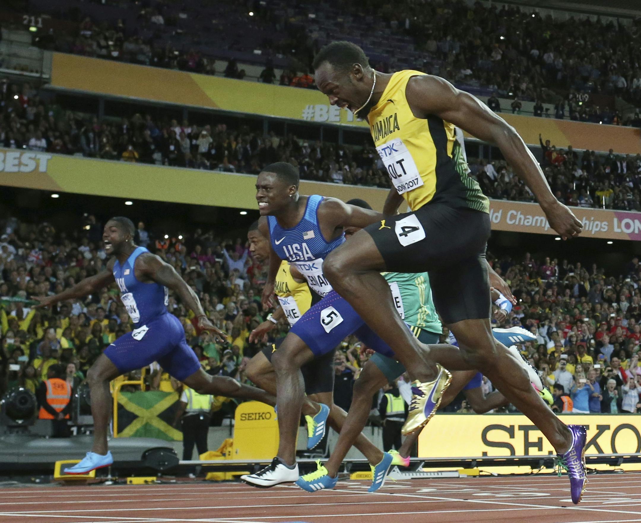 United States' Justin Gatlin, left, crosses the line to win gold ahead of silver medal winner United States' Christian Coleman, second right, and bronze medal winner Jamaica's Usain Bolt, right, in the men's 100-meter final during the World Athletics Championships in London Saturday, Aug. 5, 2017. (AP Photo/Matt Dunham)