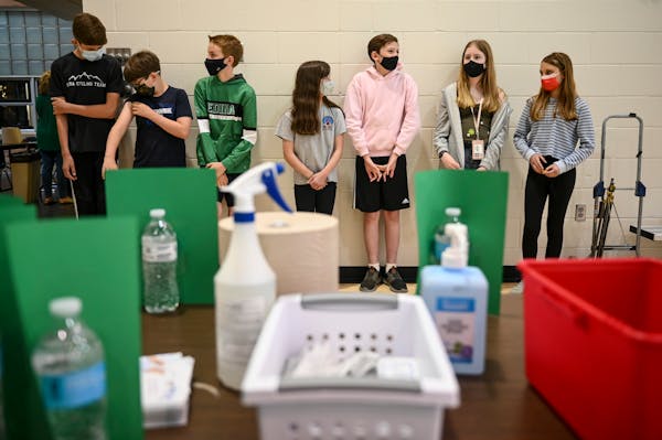 A group of South View Middle School students waited nervously for the first dose of the Pfizer BioNTech COVID-19 vaccine Friday afternoon in the schoo
