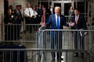 Former President Donald Trump stops to speak to reporters in the corridor as he arrives for his criminal trial in Manhattan on Friday morning, May 3, 