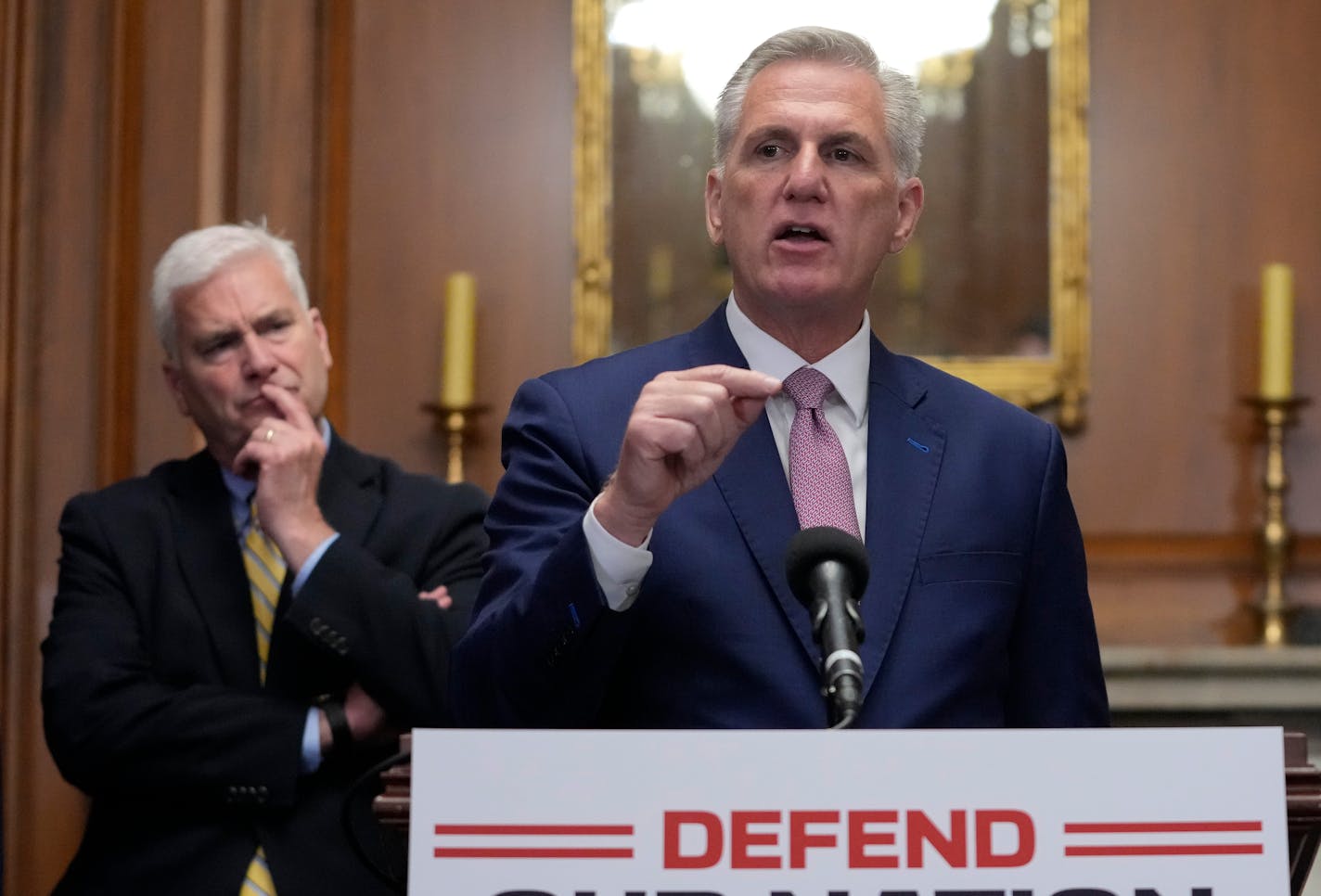 House Speaker Kevin McCarthy of Calif., speaks during a news conference after the House approved an annual defense bill, Friday, July 14, 2023, on Capitol Hill in Washington. Standing behind McCarthy are House Majority Whip Tom Emmer, R-Minn., left, and House Republican Conference Chair Elise Stefanik, R-N.Y. (AP Photo/Patrick Semansky)