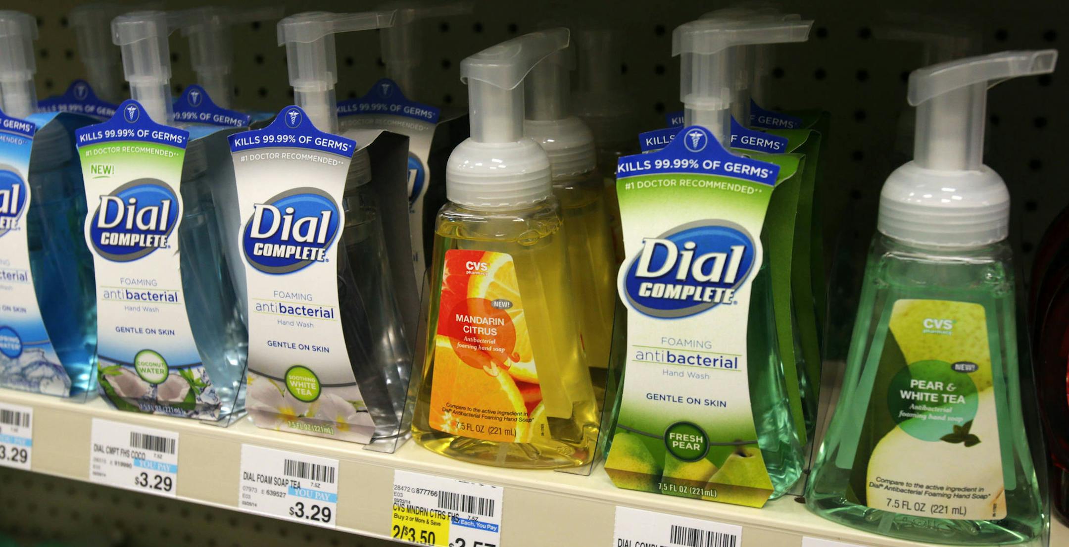 Soaps containing the antibacterial chemical triclosan are displayed on a shelf at a Minneapolis pharmacy Monday, May 19, 2014. Gov. Mark Dayton on Friday signed a bill to make Minnesota the first state to ban the use of triclosan in retail consumer cleaning products, starting Jan. 1, 2017. (AP Photo/Jim Mone)