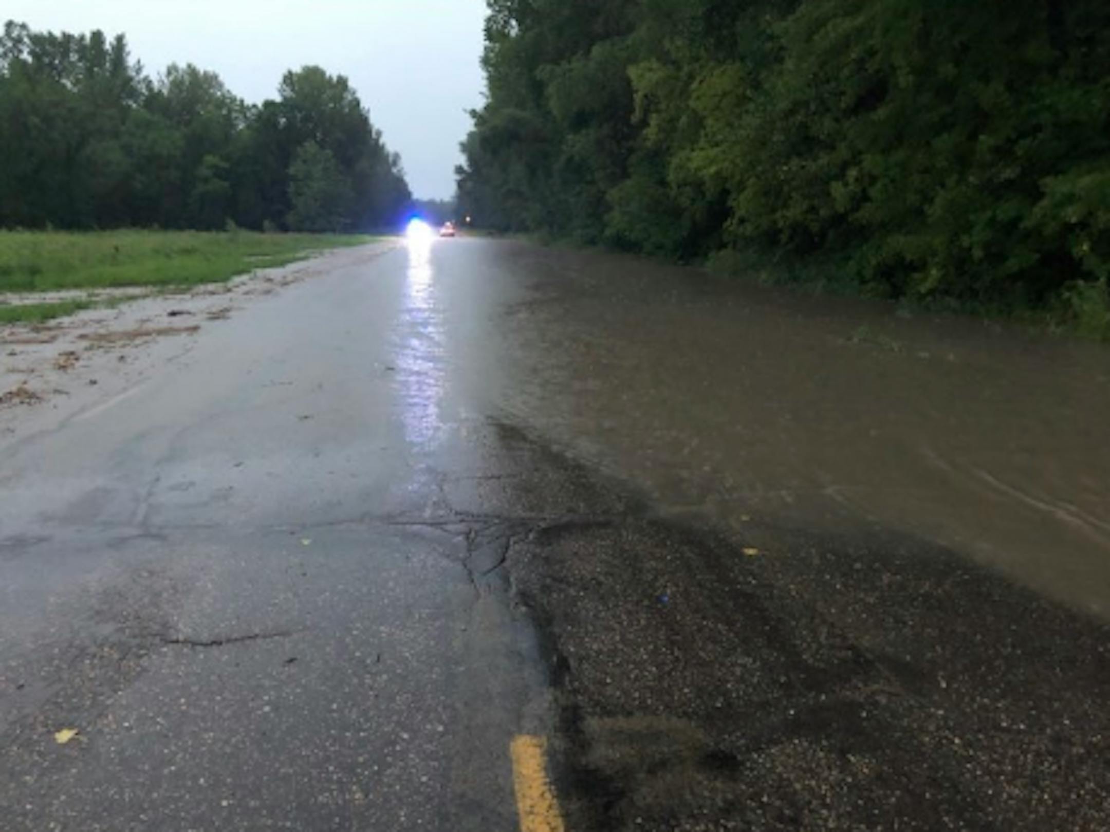 Water flowed over Hwy. 93 near Henderson, Minn., on Sunday morning, July 26, 2020.