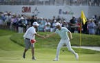 Matthew Wolff celebrated with his caddie after winning the 3M Open at TPC Twin Cities.