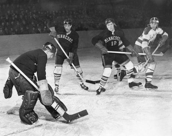 Former Minnesota governor Wendell Anderson (12) playing with the Gophers against North Dakota in 1953.