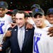 Duke coach Mike Krzyzewski celebrated with his team, including Tyus Jones (right) after winning 2015 NCAA title.