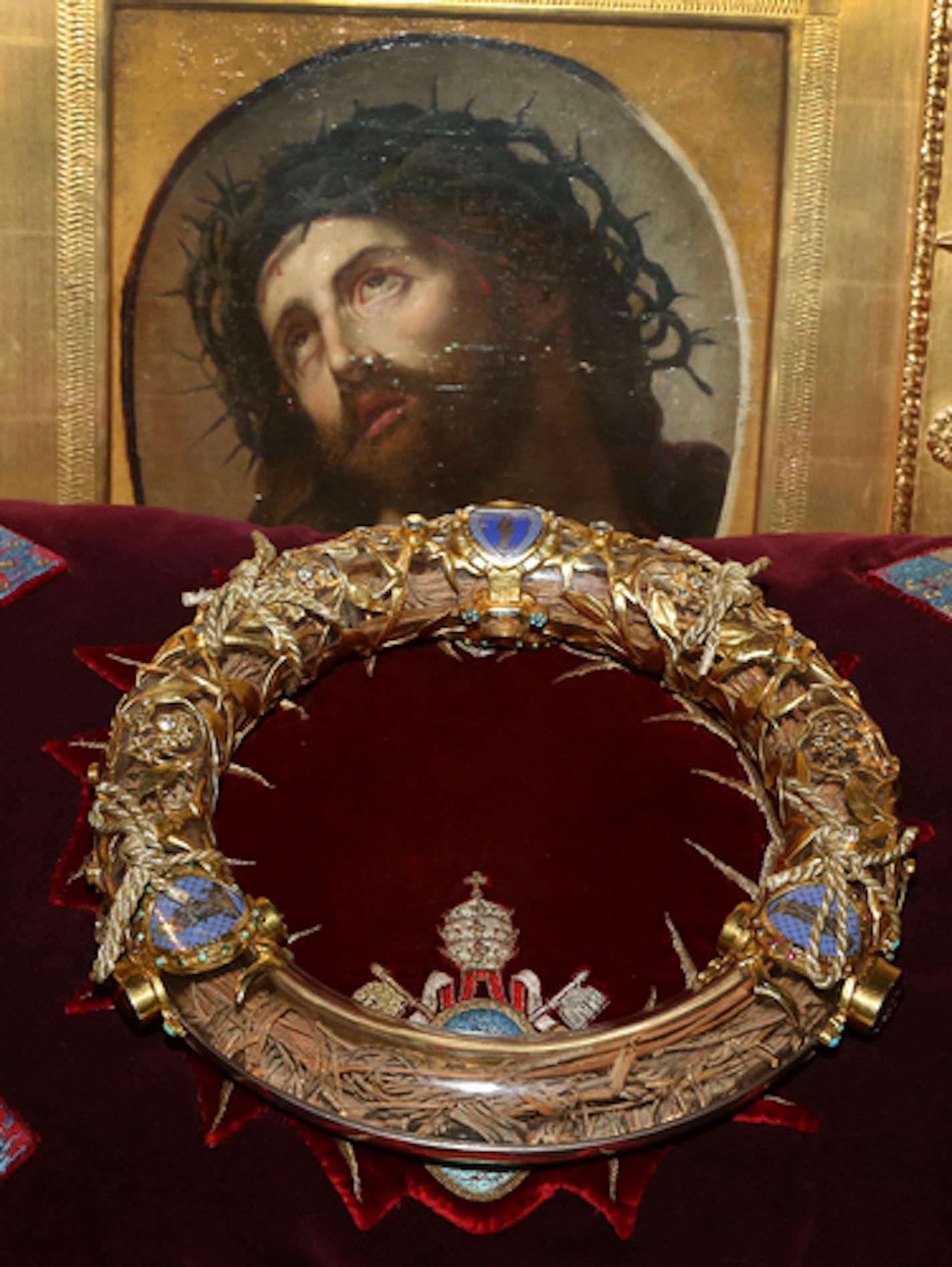 FILE - A crown of thorns which was believed to have been worn by Jesus Christ and which was bought by King Louis IX in 1239 is presented at Notre Dame Cathedral in Paris in 2014. Paris' mayor, Anne Hidalgo, said a significant collection of art and holy objects inside the church had been recovered from the fire at Notre Dame cathedral. In a tweet later, she thanked firefighters and others who formed a human chain to save artifacts. "The crown of thorns, the tunic of St. Louis and many other major