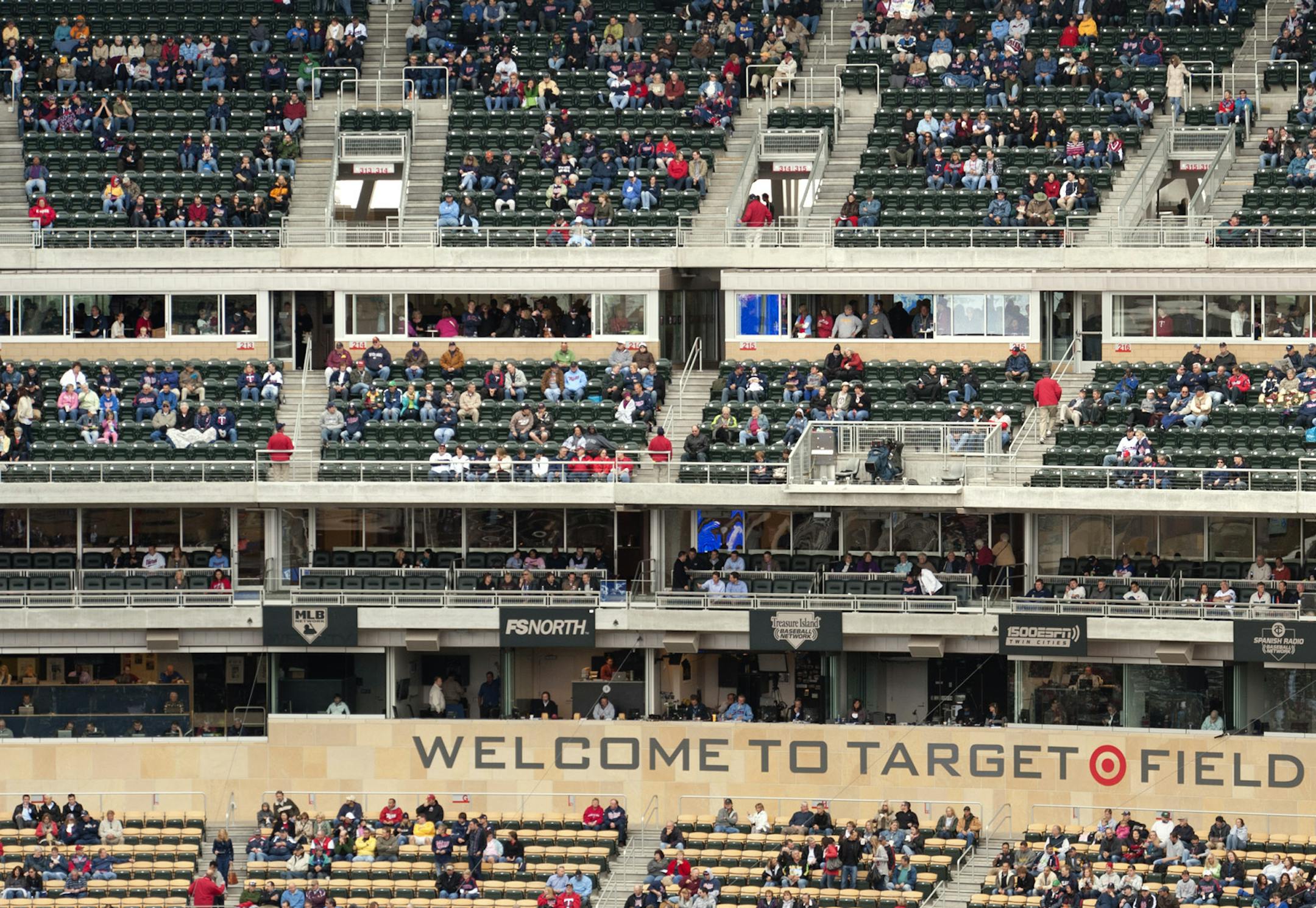 Lights came on early in the noon game at Target Field as clouds and drizzle rolled into the area. The Twins played Seattle. ] GLEN STUBBE * gstubbe@startribune.com ORG XMIT: MIN2013032720350555