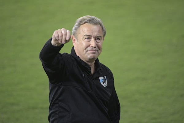 Minnesota United head coach Adrian Heath waves to fans in the stands from the field before an MLS soccer match against Orlando City Saturday, March 10